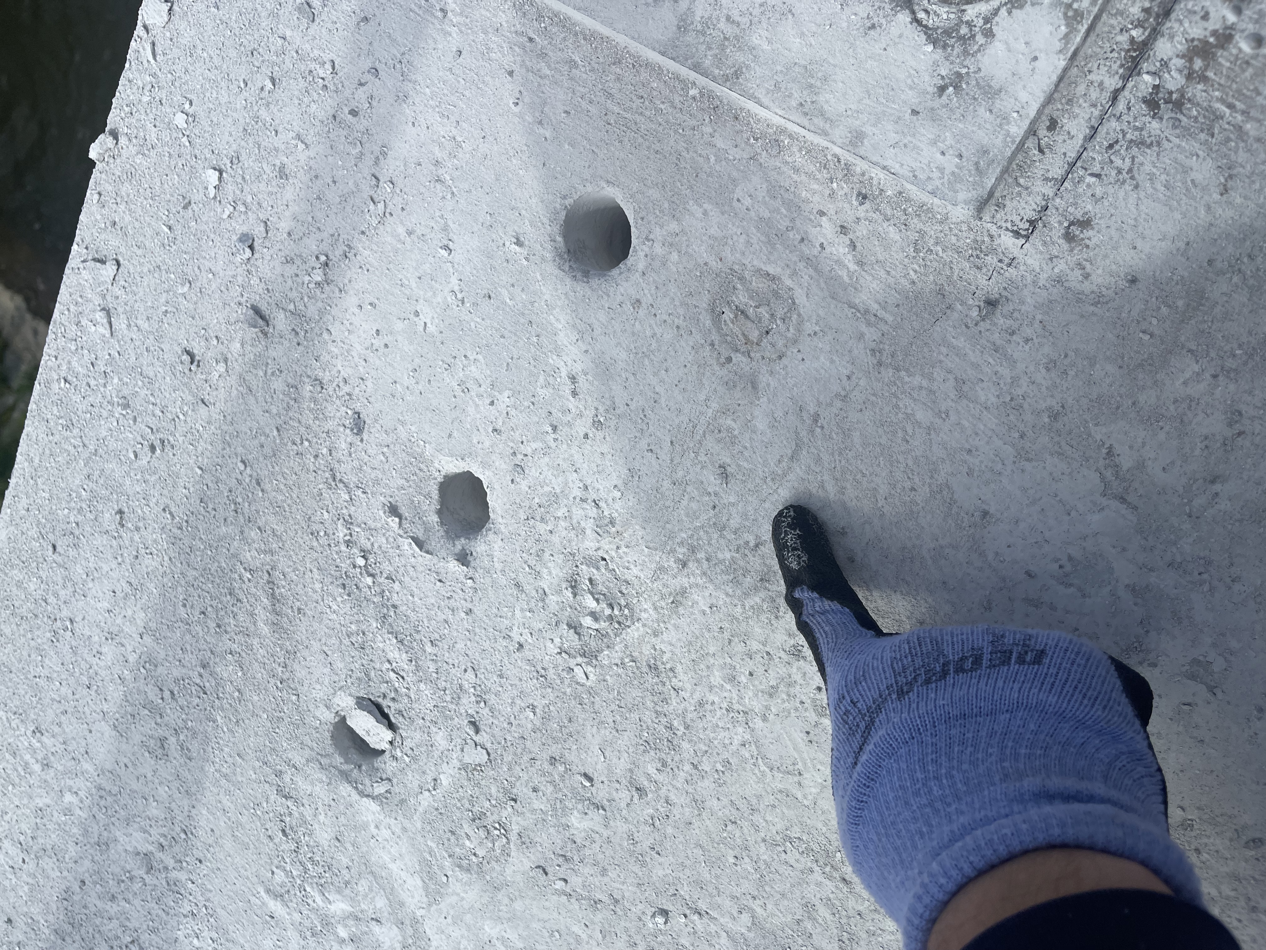 Drilled holes in reinforced concrete bridge deck