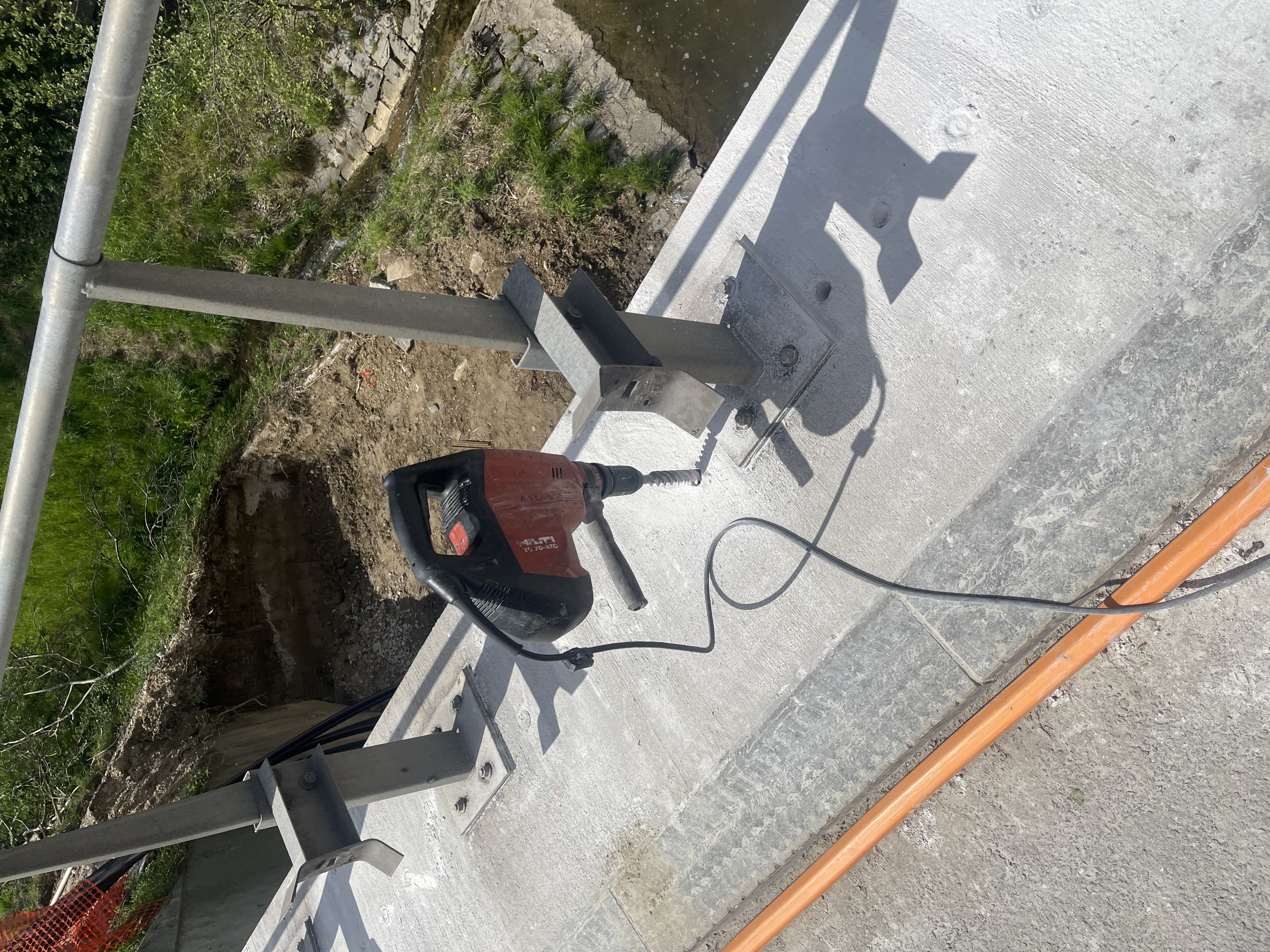 Hole pattern for controlled reinforced concrete bridge demolition
